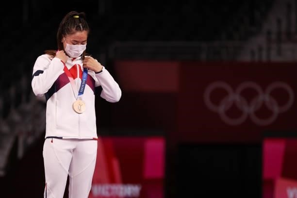 Bronze medalist Bolortuya Bat Ochir of Team Mongolia poses with the bronze medal during the Women's Freestyle 53kg medal ceremony on day fourteen of...