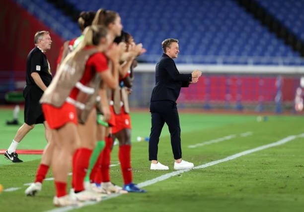 Beverly Priestman, Head Coach celebrates their side's first goal scored by Jessie Fleming of Team Canada during the Women's Gold Medal Match between...