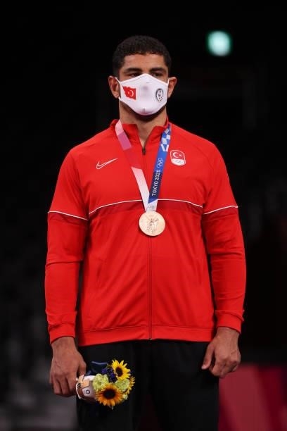 Bronze medalist Taha Akgul of Team Turkey poses with the bronze medal during the Men's Freestyle 125kg medal ceremony on day fourteen of the Tokyo...