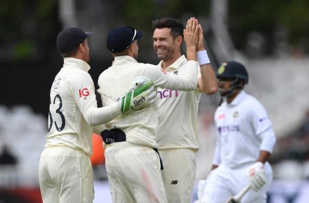 England bowler James Anderson celebrates with Joe Root after the pair combine to dismiss India batsman Thakur during day three of the First Test...