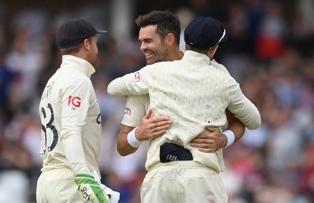 James Anderson of England celebrates with Joe Root and Jos Buttler after dismissing Shardul Thakur of India during the third day of the 1st LV= Test...