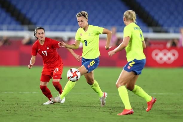Lina Hurtig of Team Sweden battles for possession with Jessie Fleming of Team Canada during the Women's Gold Medal Match between Canada and Sweden on...