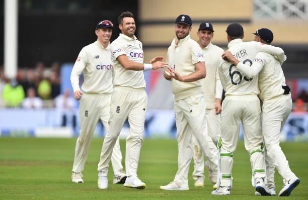 James Anderson of England celebrates with his teammates after getting Shardul Thakur of India out during day three of the First Test Match between...