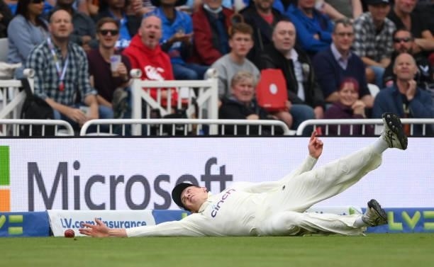 England fielder Zak Crawley fails in a diving attempt to stop a boundary during day three of the First Test Match between England and India at Trent...
