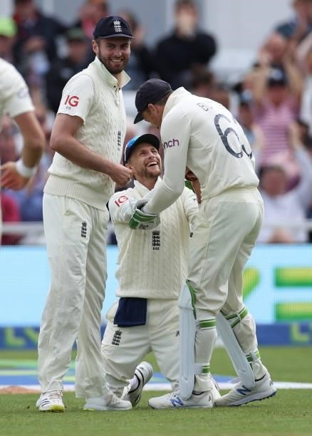 Joe Root of England celebrates with Jos Buttler of England after catching Shardul Thakur of India off the bowling of James Anderson during day three...