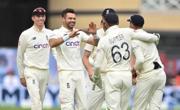 James Anderson of England celebrates with his teammates getting Shardul Thakur of India out during day three of the First Test Match between England...