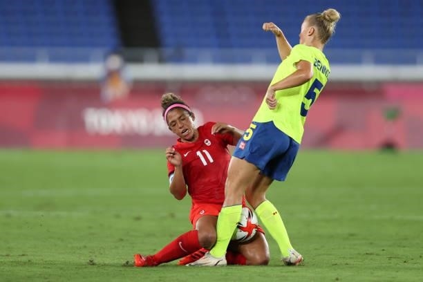 Desiree Scott of Team Canada is challenged by Hanna Bennison of Team Sweden during the Women's Gold Medal Match between Canada and Sweden on day...