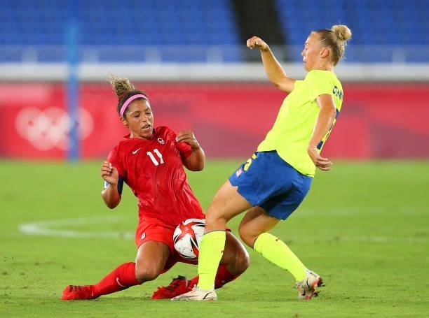 Desiree Scott of Team Canada battles for possession with Hanna Bennison of Team Sweden during the Women's Gold Medal Match between Canada and Sweden...