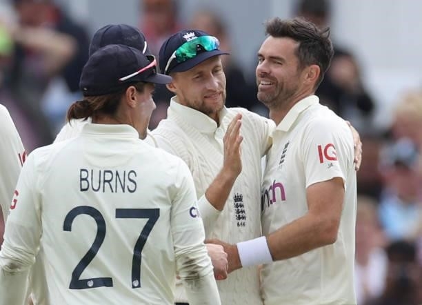 Joe Root of England celebrates with James Anderson of England after catching Shardul Thakur of India during day three of the First LV= Insurance test...