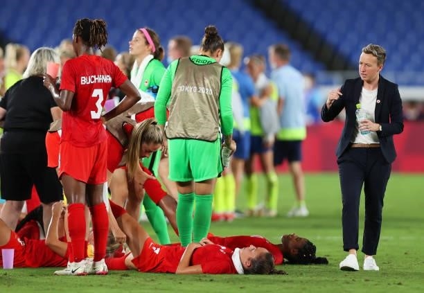 Beverly Priestman, Head Coach speaks with her players ahead of extra-time during the Women's Gold Medal Match between Canada and Sweden on day...