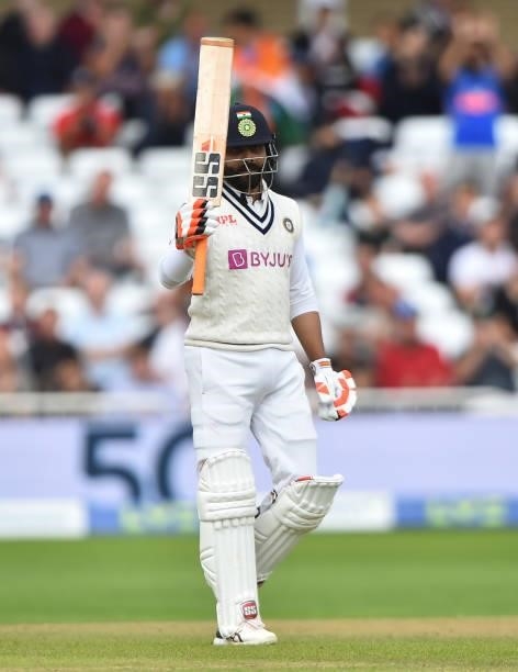 Ravindra Jadeja of India raises his bat after scoring 50 runs during day three of the First Test Match between England and India at Trent Bridge on...