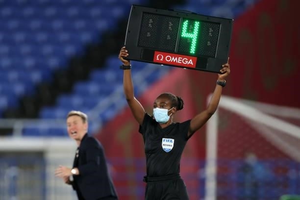 Fourth Official Salima Mukansanga displays a board for 4 minuets added time during the Women's Gold Medal Match between Canada and Sweden on day...