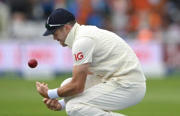 England fielder James Anderson reacts after dropping a catch off India batsman Mohammed Shami during day three of the First Test Match between...