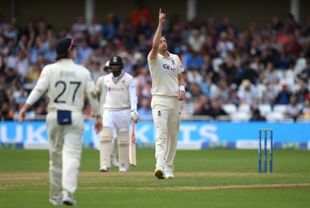 England bowler Ollie Robinson celebrates the wicket of India batsmen Shami during day three of the First Test Match between Enaches 50 runs gland and...