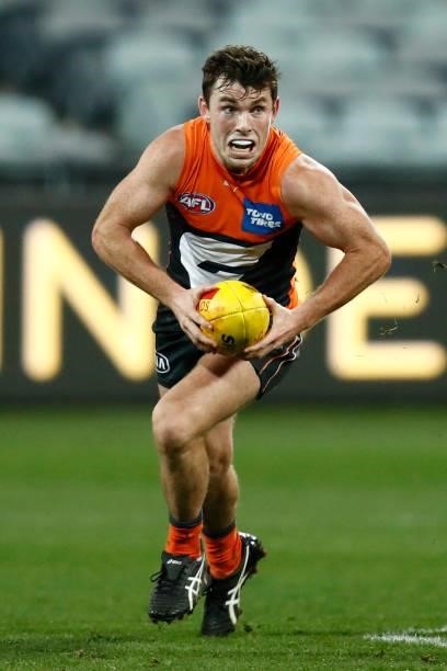 Brent Daniels of the Giants runs with the ball during the round 21 AFL match between Geelong Cats and Greater Western Sydney Giants at GMHBA Stadium...