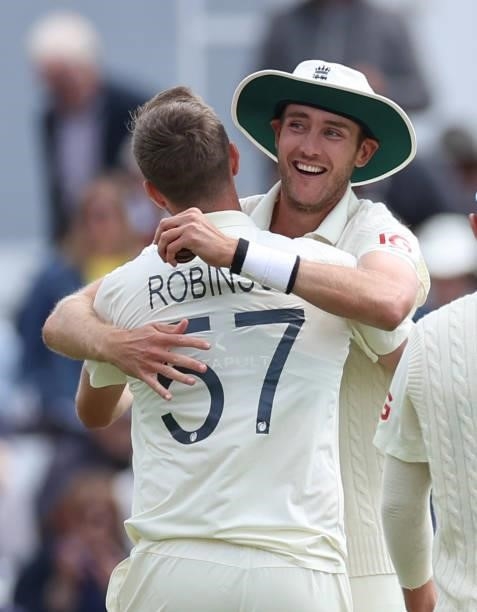 Stuart Broad congratulates Ollie Robinson after he took the wicket of Jasprit Bumrah during day three of the First LV= Insurance test match between...