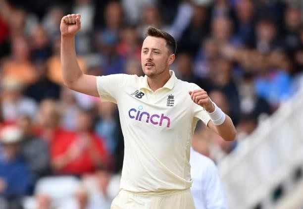 Ollie Robinson of England celebrates after dismissing Jasprit Bumrah of India and claiming his fifth wicket during the third day of the 1st LV= Test...