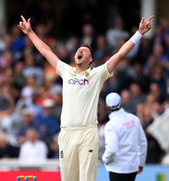 Ollie Robinson of England celebrates after dismissing Jasprit Bumrah of India and claiming his fifth wicket during the third day of the 1st LV= Test...