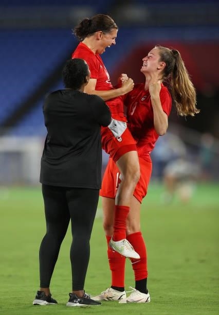 Christine Sinclair and Jordyn Huitema of Team Canada celebrate following their team's victory in the penalty shoot out in the Women's Gold Medal...