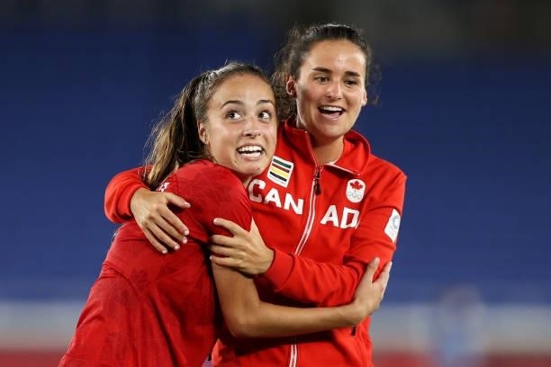 Julia Grosso and Evelyne Viens of Team Canada celebrate following their team's victory in the penalty shoot out in the Women's Gold Medal Match...