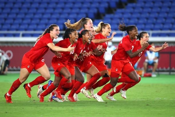 Team Canada celebrates after defeating Team Sweden in a penalty shoot-out to win gold in the women's football gold medal match between Canada and...