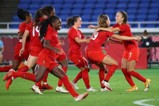 Julia Grosso of Team Canada celebrates after scoring the game-winning goal during the penalty kick shoot-out to win the women's football gold medal...