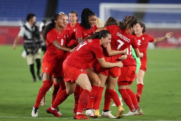 Julia Grosso of Team Canada celebrates with Jordyn Huitema, Vanessa Gilles and teammates after scoring the winning penalty in the shootout during the...