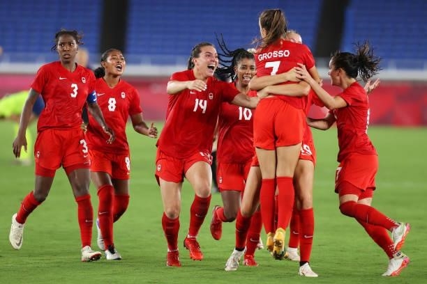 Julia Grosso of Team Canada celebrates with Jordyn Huitema, Vanessa Gilles and teammates after scoring the winning penalty in the shootout during the...