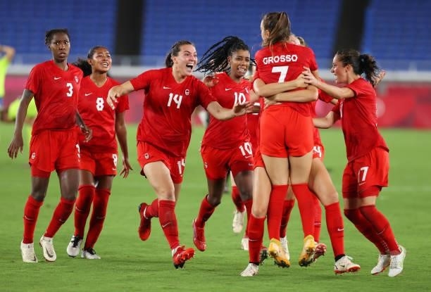 Julia Grosso of Team Canada celebrates with Vanessa Gilles, Ashley Lawrence, Jordyn Huitema and teammates after scoring the winning penalty in the...