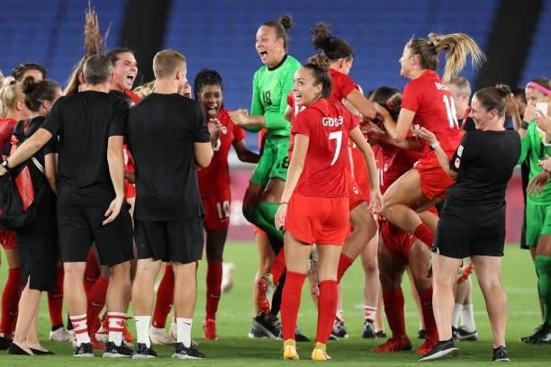 Julia Grosso of Team Canada and teammates celebrate after their team's victory in the penalty shootout during the Women's Gold Medal Match between...