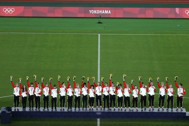 Gold Medalists of Team Canada celebrate with their gold medals during the Women's Football Competition Medal Ceremony on day fourteen of the Tokyo...