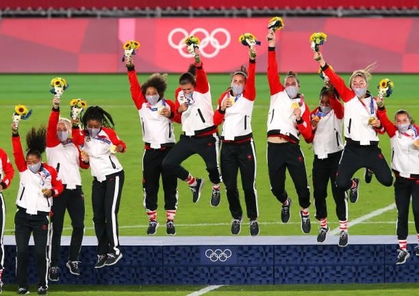 Gold medalist Christine Sinclair and teammates of Team Canada celebrate with their gold medals during the Women's Football Competition Medal Ceremony...