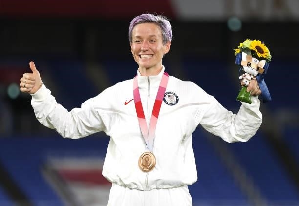 Bronze medalist Megan Rapinoe of Team United States poses with their bronze medal during the Women's Football Competition Medal Ceremony on day...