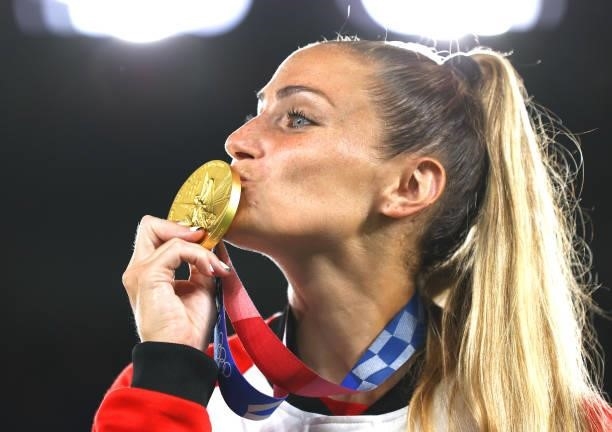 Gold medalist Shelina Zadorsky of Team Canada kisses their gold medal during the Women's Football Competition Medal Ceremony on day fourteen of the...