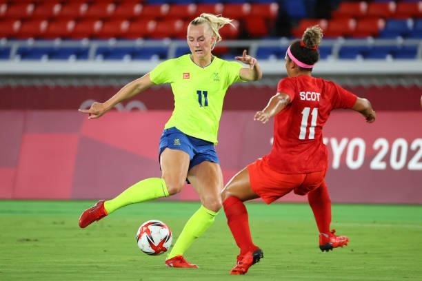 Stina Blackstenius of Team Sweden controls the ball against Desiree Scott of Team Canada during the second half during the women's football gold...
