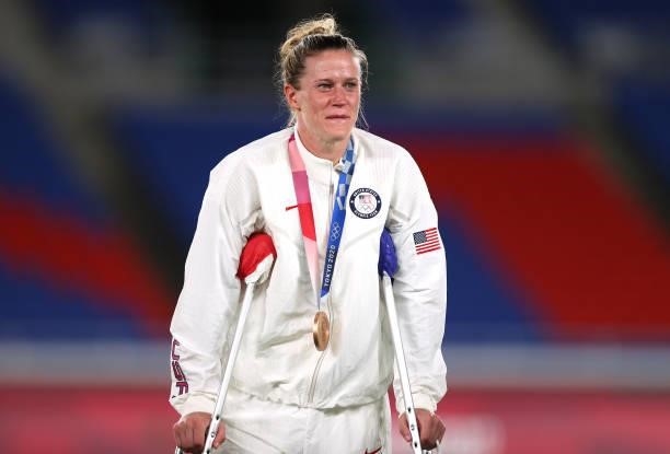 Bronze medalist Alyssa Naeher of Team United States reacts with her bronze medal during the Women's Football Competition Medal Ceremony on day...