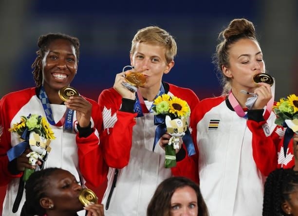 Gold medalist Quinn of Team Canada kisses their gold medal during the Women's Football Competition Medal Ceremony on day fourteen of the Tokyo 2020...