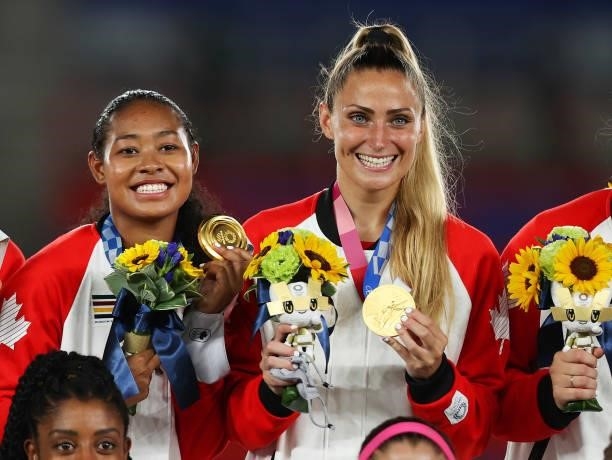 Gold medalists Jayde Riviere and Shelina Zadorsky of Team Canada pose with their medals during the Women's Football Competition Medal Ceremony on day...