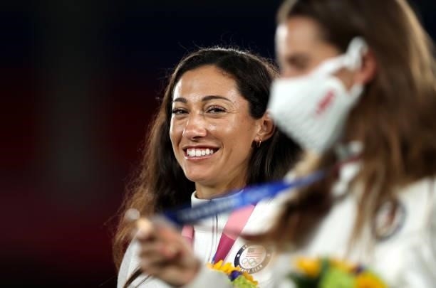 Bronze medalist Christen Press of Team United States reacts with her bronze medal during the Women's Football Competition Medal Ceremony on day...