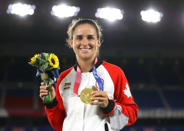Gold medalist Evelyne Viens of Team Canada poses with their gold medal during the Women's Football Competition Medal Ceremony on day fourteen of the...