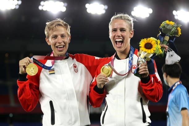 Gold medalists Quinn and Sophie Schmidt of Team Canada pose with their gold medals during the Women's Football Competition Medal Ceremony on day...