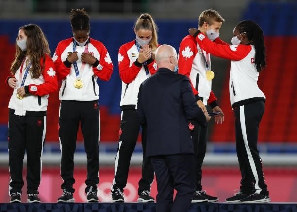 Gold medalist Quinn of Team Canada is awarded with their gold medal during the Women's Football Competition Medal Ceremony on day fourteen of the...