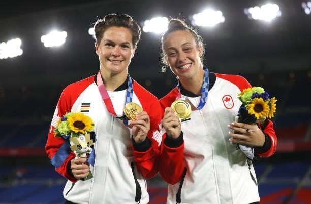 Gold medalists Evelyne Viens and Kailen Sheridan of Team Canada pose with their medals during the Women's Football Competition Medal Ceremony on day...