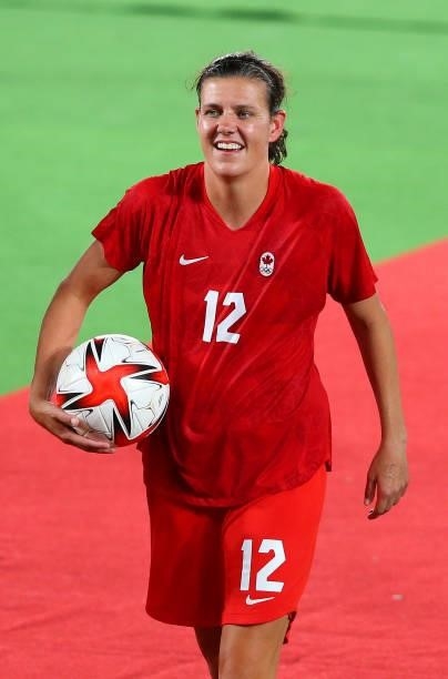 Christine Sinclair of Team Canada walks off the pitch as they celebrate after their team's victory in the penalty shootout during the Women's...