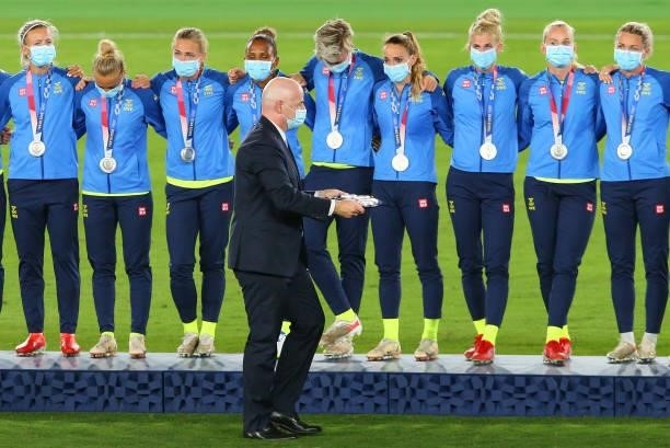 Gianni Infantino, President of FIFA carries out the medals past silver medalists Team Sweden during the Women's Football Competition Medal Ceremony...