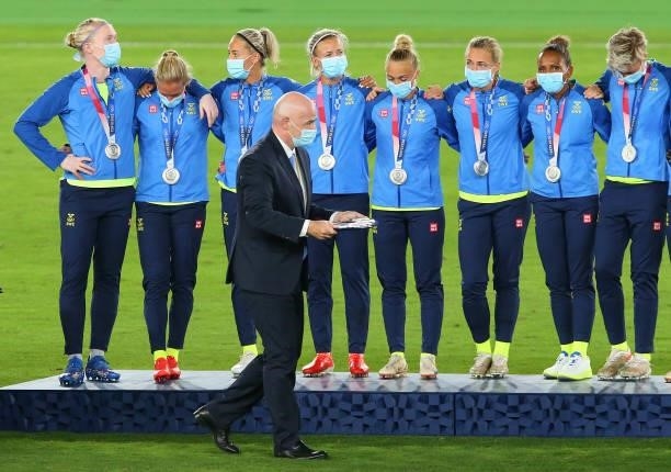 Gianni Infantino, President of FIFA carries out the medals past silver medalists Team Sweden during the Women's Football Competition Medal Ceremony...