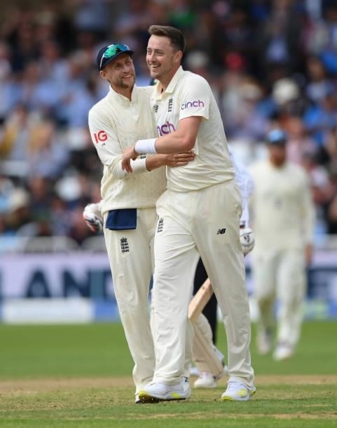 England bowler Ollie Robinson celebrates with Joe Root after taking his 5th wicket of India batsmen Jasprit Bumrah during day three of the First Test...