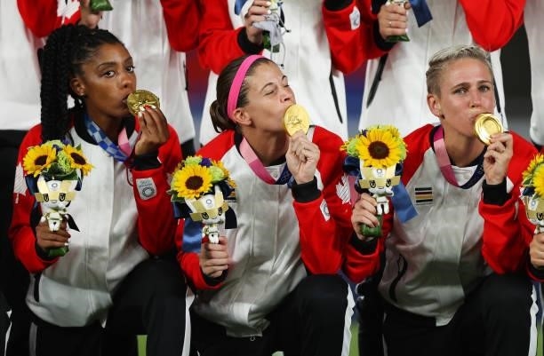 Gold medalist Stephanie Labbe of Team Canada kisses her gold medal during the Women's Football Competition Medal Ceremony on day fourteen of the...