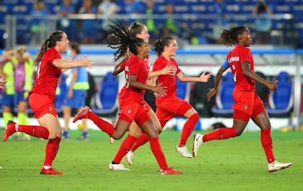 Players of Team Canada celebrate following their team's victory in the penalty shoot out after the Women's Gold Medal Match between Canada and Sweden...