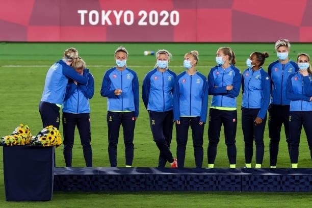 Players of Sweden attend the award ceremony of the Olympic women's football gold medal match between Sweden and Canada at International Stadium...